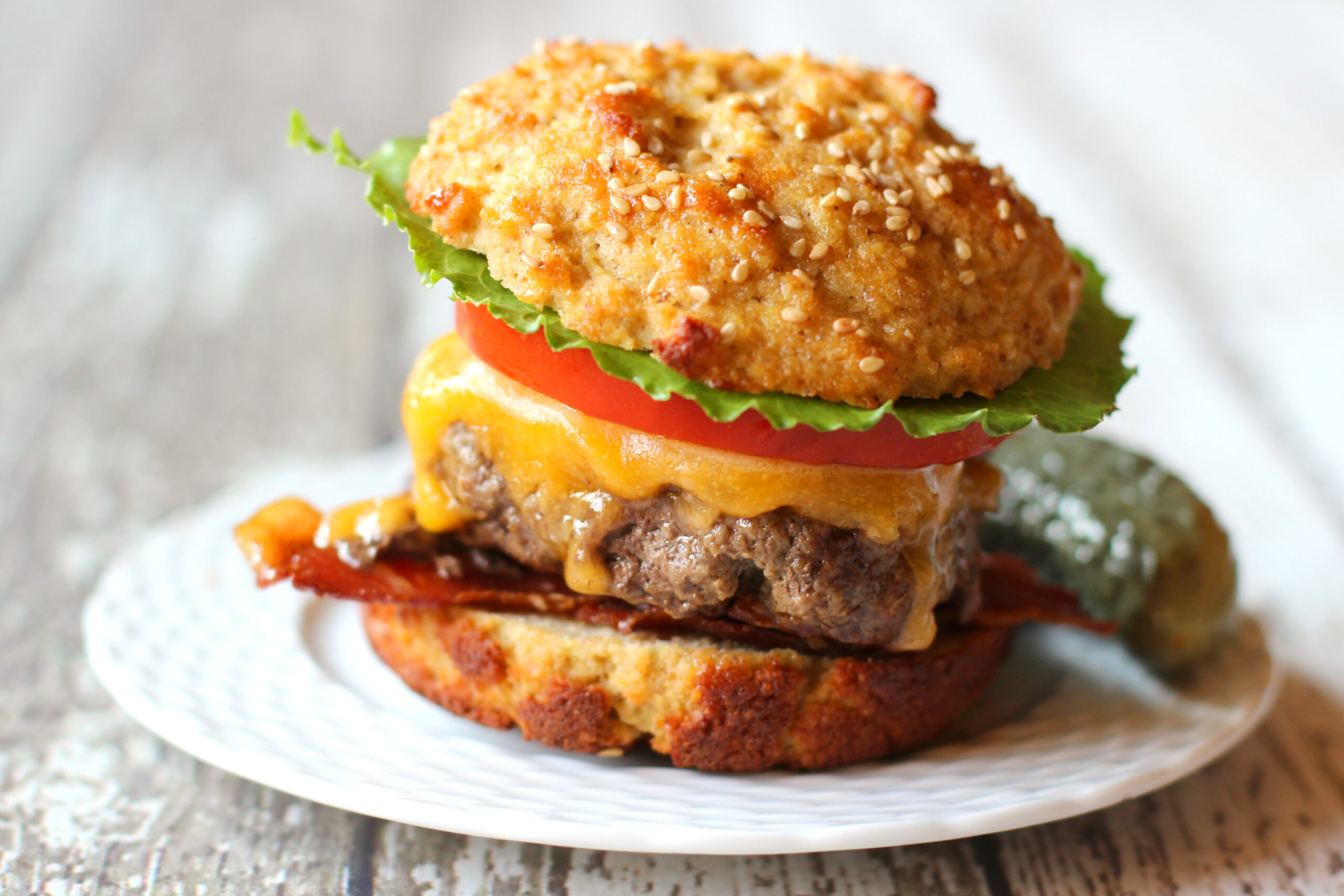 Keto-friendly burger buns used in a sandwich with lettuce and a burger patty