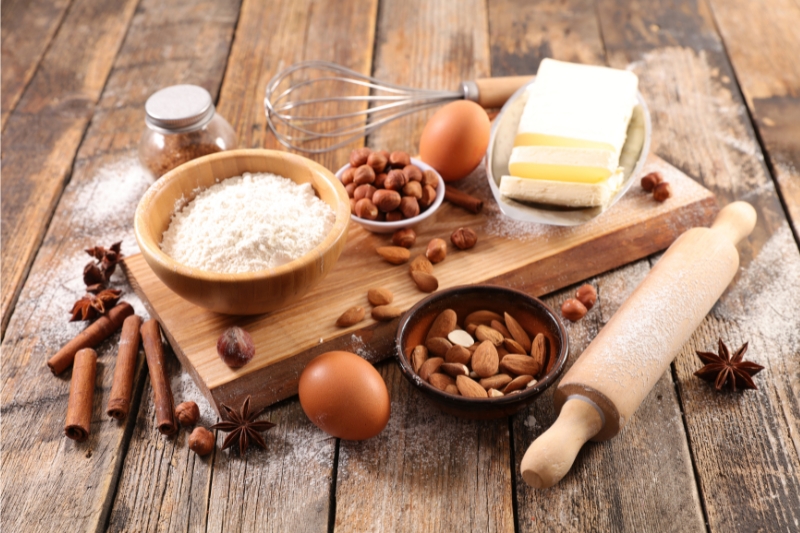 Top-down view of keto-friendly baking ingredients, including low-carb flour, eggs, butter, and nuts